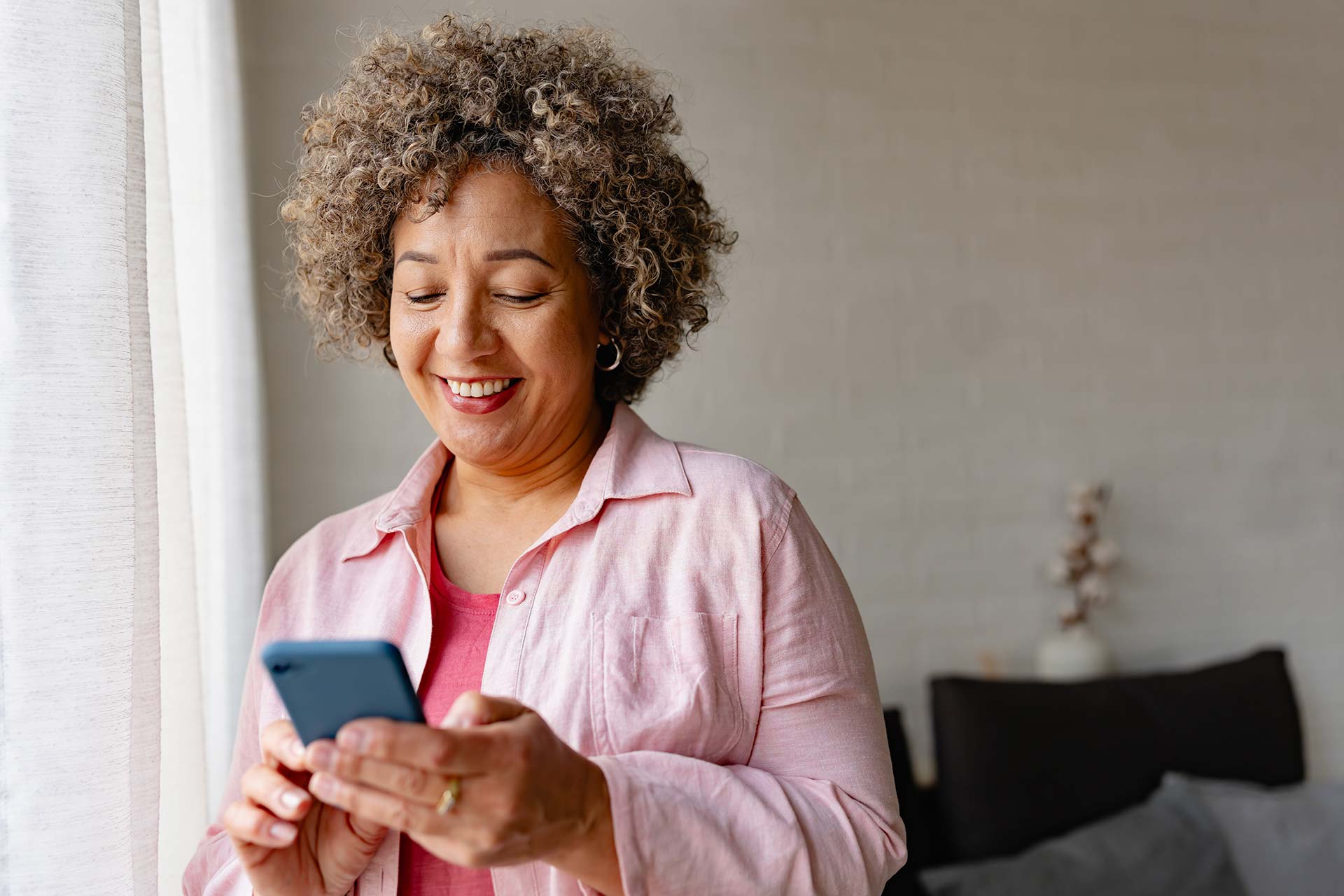 A woman scrolling on her phone